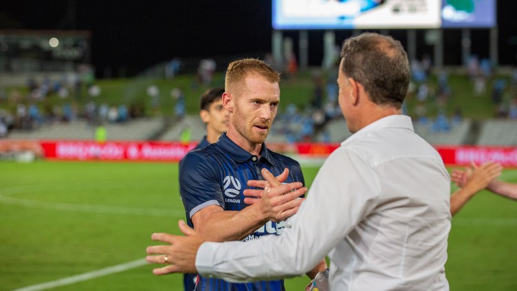 Alen Stajcic and Oliver Bozanic embrace after Friday's win