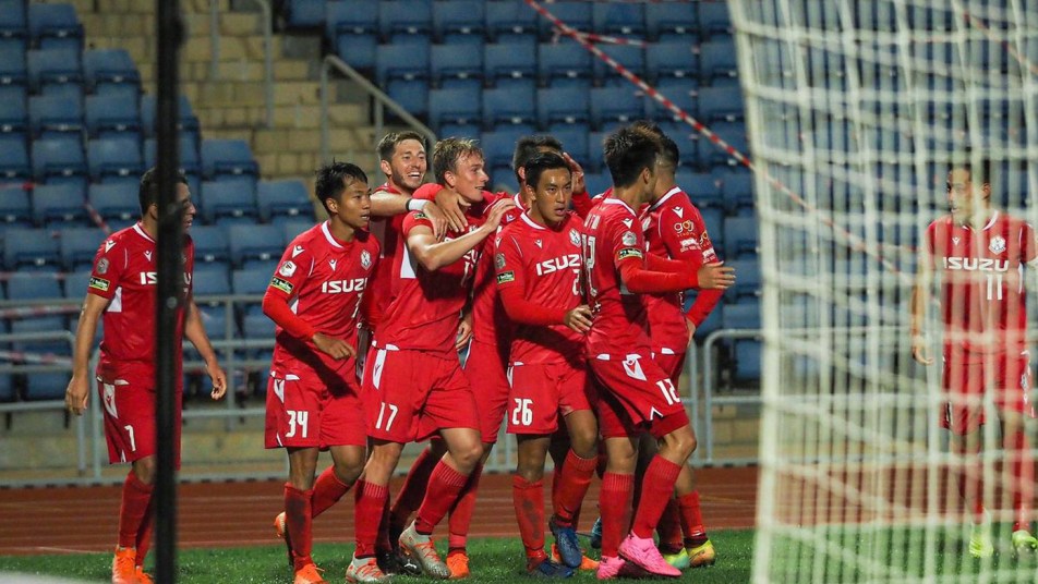 Matt Cahill celebrates with teammates in Hong Kong