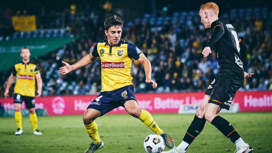 Josh Nisbet duels with a Brisbane player on Wednesday night