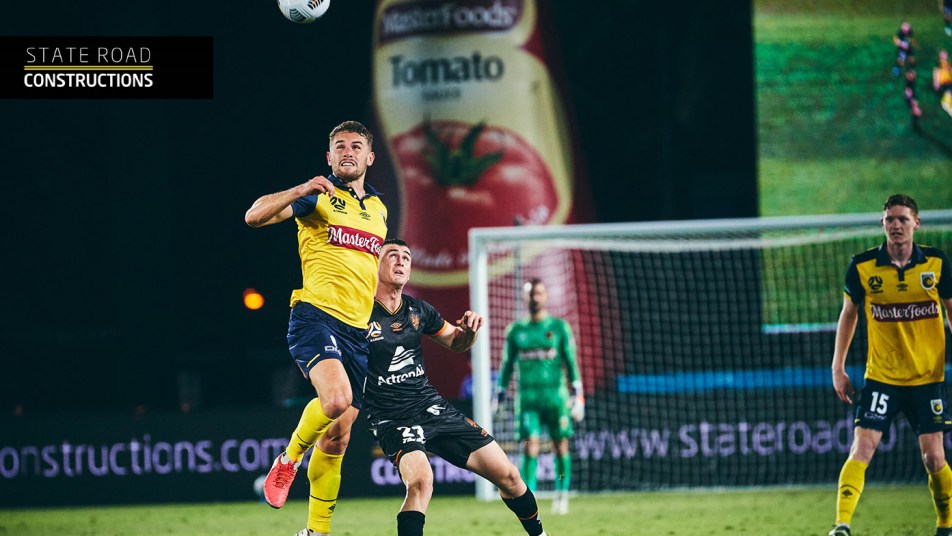 Gianni Stensness wins a header over Dylan Wenzell-Halls