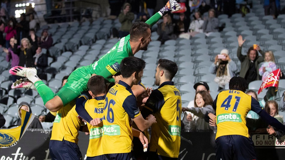 The Mariners celebrate after Marco Urena's sealer