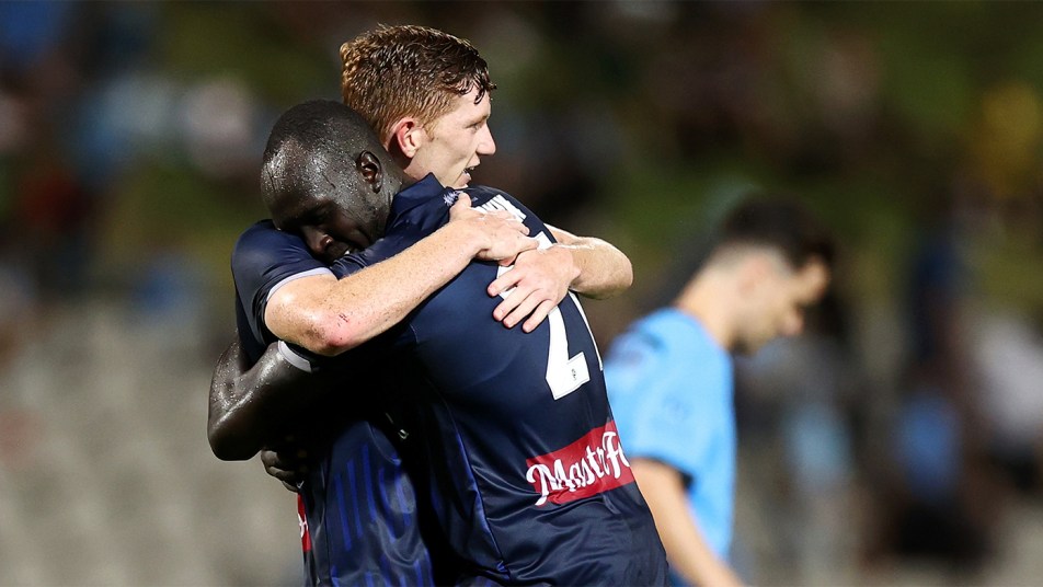 Ruon and Rowles embrace after beating Sydney