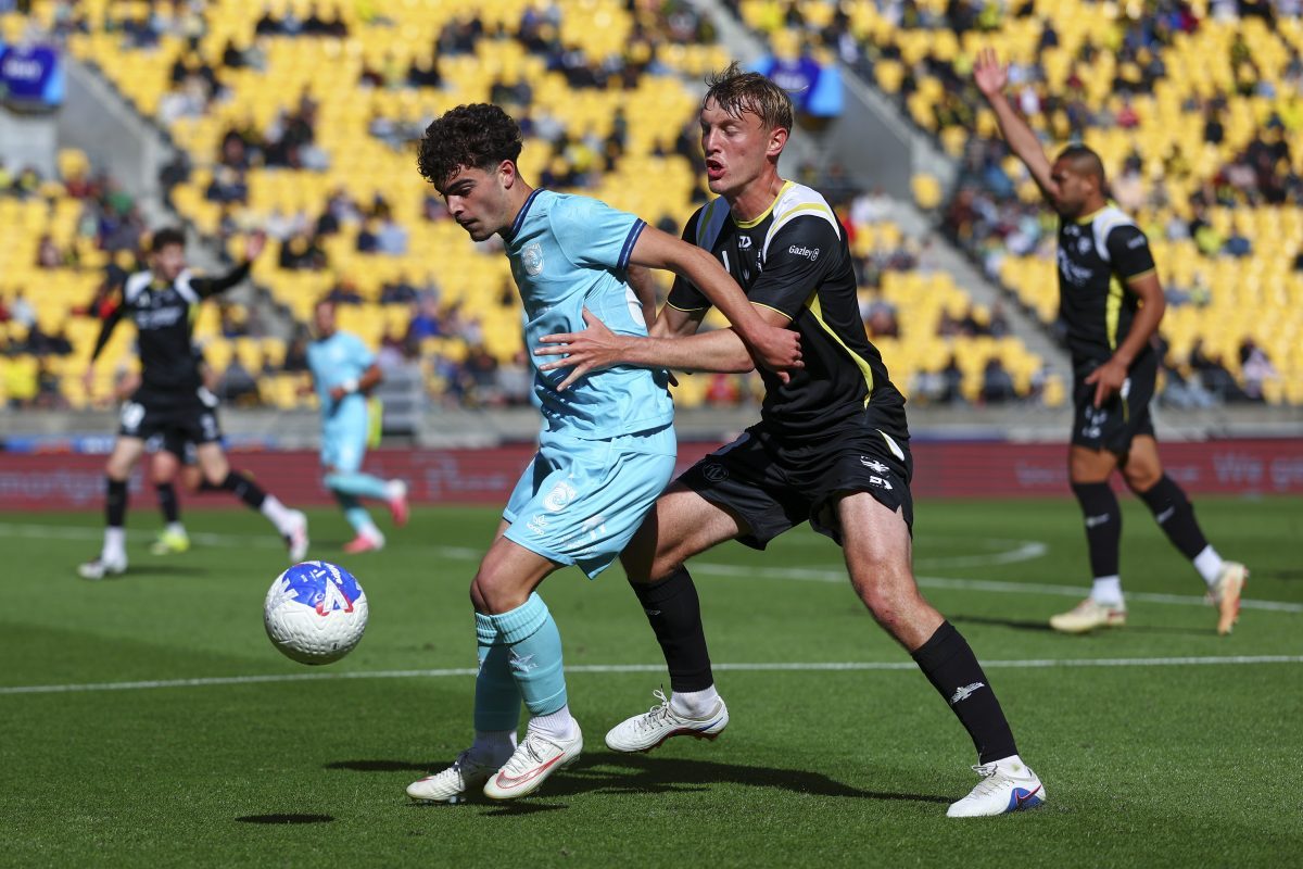 Luke Becvinovski of the Mariners is challenged by Max Anderson of the Phoenix at Hnry Stadium.
